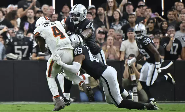 Cleveland Browns quarterback Deshaun Watson (4) is sacked by Las Vegas Raiders defensive end Charles Snowden during the second half of an NFL football game Sunday, Sept. 29, 2024, in Las Vegas. (AP Photo/David Becker)