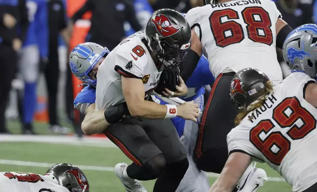 Tampa Bay Buccaneers quarterback Baker Mayfield (6) is sacked by Detroit Lions defensive end Aidan Hutchinson during the first half of an NFL football game, Sunday, Sept. 15, 2024, in Detroit. (AP Photo/Duane Burleson)