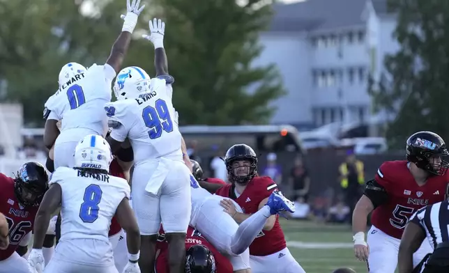 The Buffalo defense blocks an overtime field goal attempt by Northern Illinois place kicker Kanon Woodill in an NCAA college football game Saturday, Sept. 21, 2024, in DeKalb, Ill. (AP Photo/Charles Rex Arbogast)