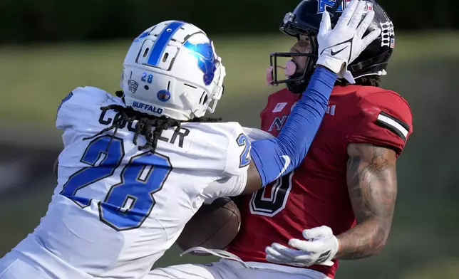 Buffalo cornerback Marquis Cooper breaks up a pass intended for Northern Illinois wide receiver Cam Thompson in the end zone, during the second half of an NCAA college football game Saturday, Sept. 21, 2024, in DeKalb, Ill. (AP Photo/Charles Rex Arbogast)