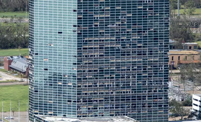 FILE - This aerial photo shows broken windows of the Hertz Building from Hurricane Laura, Thursday, Aug. 27, 2020, in Lake Charles, La. (Bill Feig/The Advocate via AP, Pool, File)