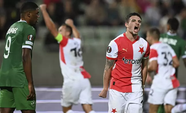 Slavia Praha's Christos Zafeiris reacts after Mojmír Chytil scored his goal against Ludogorets during a Europa League soccer match at Ludogorets Arena, Razgrad, Bulgaria, Wednesday, Sept. 25, 2024. (AP Photo/Tony Uzunov)