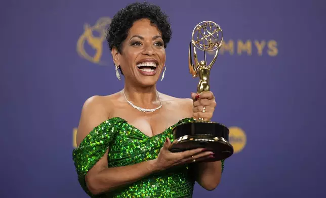 Liza Colon-Zayas poses in the press room with the award for outstanding supporting actress in a comedy series for "The Bear during the 76th Primetime Emmy Awards on Sunday, Sept. 15, 2024, at the Peacock Theater in Los Angeles. (AP Photo/Jae C. Hong)