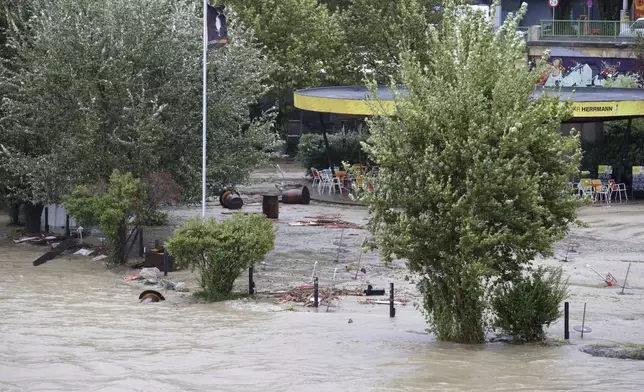 The Donaukanal channel overflows its banks in central Vienna, Austria, Sunday, Sept. 15, 2024. (AP Photo/Heinz-Peter Bader)