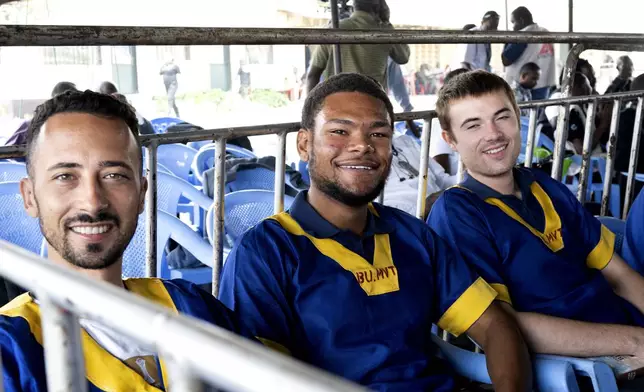 CORRECTS ID: Benjamin Reuben Zalman-Polun, left, Marcel Malanga and Tyler Thompson, all American citizens, attend a court verdict in Congo, Kinshasa, Friday, Sept. 13, 2024, on charges of taking part in a coup attempt in May 2024. (AP Photo/Samy Ntumba Shambuyi)