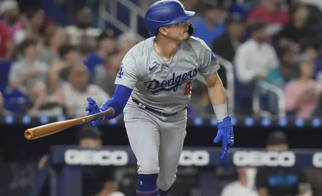 CORRECTS PLAYER TO KIKE HERNANDEZ INSTEAD OF TEOSCAR HERNANDEZ - Los Angeles Dodgers' Kiké Hernández (8) hits a three-run home run during the fourth inning of a baseball game against the Miami Marlins, Wednesday, Sept. 18, 2024, in Miami. (AP Photo/Marta Lavandier)