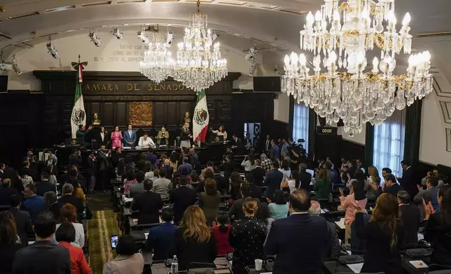 CORRECTS TO REMOVE THAT SENATORS ARE DISCUSSING JUDICIAL REFORM - Senators hold a session in alternate headquarters due to protesters opposing judicial reform blocking access to their regular chambers, in Mexico City, Thursday, Sept. 5, 2024, one day after Mexico's lower house approved the reform that would require all judges to stand for election. (AP Photo/Felix Marquez)