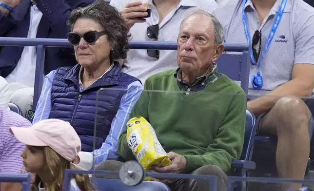 CORRECTS SPELLING OF LAST NAME TO BLOOMBERG, NOT BLOOMBURG - Michael Bloomberg and partner Diana Taylor, left, watch the women's singles final of the U.S. Open tennis championships between Aryna Sabalenka, of Belarus, and Jessica Pegula, of the United States, Saturday, Sept. 7, 2024, in New York. (AP Photo/Frank Franklin II)