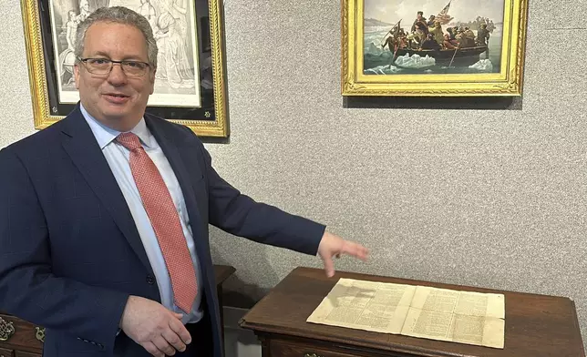 CORRECTS NAME TO BRUNK AUCTIONS - Historian Seth Kaller shows off a 1787 copy of the U.S. Constitution that will be put up for auction on Sept. 28, 2024 at Brunk Auctions in Asheville, N.C., on Thursday, Sept. 5. (AP Photo/Jeffrey Collins)