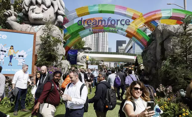 Thousands enter Salesforce's Dreamforce National Park entrance at Moscone Center in San Francisco on Tuesday, Sept. 17, 2024. (Brontë Wittpenn/San Francisco Chronicle via AP)