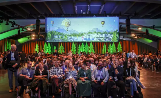 Thousands pack the Moscone South Hall in preparation for keynote speakers like CEO Marc Benioff during Dreamforce in San Francisco, Tuesday, Sept. 17, 2024. (Brontë Wittpenn/San Francisco Chronicle via AP)