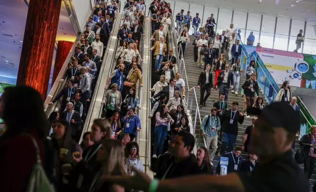 Thousands make their way to the Moscone South Hall in preparation for keynote speakers, including Salesforce CEO Marc Benioff, during Dreamforce in San Francisco on Tuesday, Sept. 17, 2024. (Brontë Wittpenn/San Francisco Chronicle via AP)