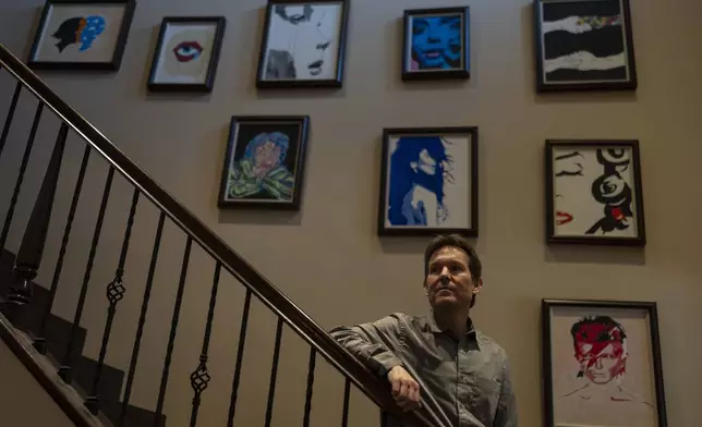 Matt Capelouto, whose daughter, Alexandra, died from a fentanyl overdose, stands for a photo in front of a wall decorated with his daughter's artworks in Temecula, Calif., Tuesday, Sept. 17, 2024. (AP Photo/Jae C. Hong)