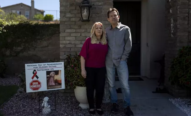 Matt Capelouto and his wife, Christine, whose daughter, Alexandra, died from a fentanyl overdose, stand for a photo outside their home in Temecula, Calif., Tuesday, Sept. 17, 2024. (AP Photo/Jae C. Hong)