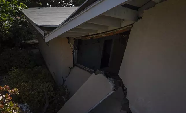 A home severely damaged by ongoing landslides is seen in Rancho Palos Verdes, Calif., Tuesday, Sept. 3, 2024. (AP Photo/Jae C. Hong)