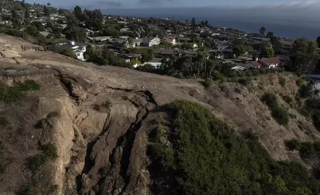 An aerial view shows a collapsed hillside due to ongoing landslides in Rancho Palos Verdes, Calif., Tuesday, Sept. 3, 2024. (AP Photo/Jae C. Hong)