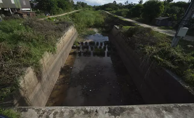 A water gate to the Funan Techo Canal is seen at Prek Takeo village, eastern Phnom Penh, Cambodia, Tuesday, July 30, 2024. (AP Photo/Heng Sinith)