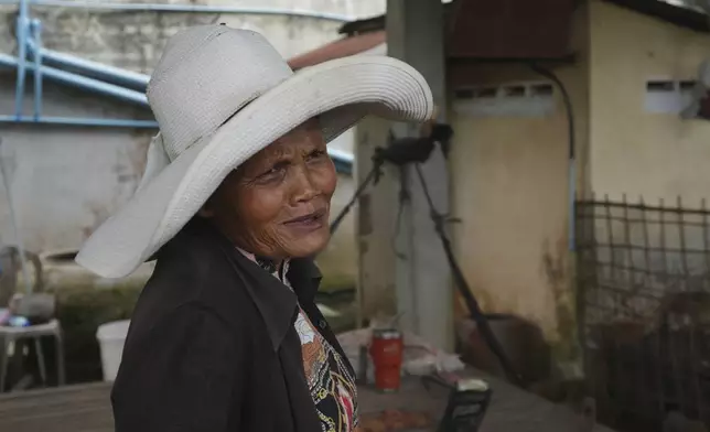 Sok Koeun, a villager who lives along the Funan Techo Canal, is interviewed by The Associated Press at her home at Prek Takeo village, eastern Phnom Penh Cambodia, Tuesday, July 30, 2024. (AP Photo/Heng Sinith)