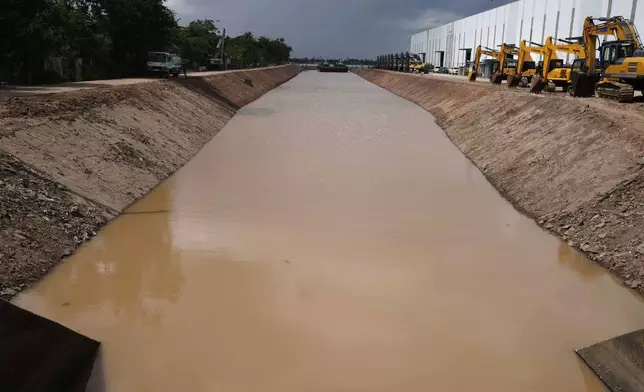 A view from a water gate to the Funan Techo Canal connecting from Mekong River at Prek Takeo village, eastern Phnom Penh Cambodia, Tuesday, July 30, 2024. (AP Photo/Heng Sinith)