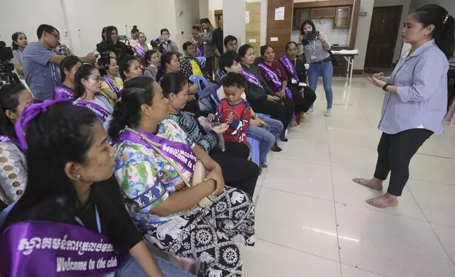 Chhim Sithar, right, a union leader being freed from prison after serving time for her part in a strike against the country’s biggest casino, speaks to her supporters at a club on the outskirts of Phnom Penh Cambodia, Monday, Sept. 16, 2024. (AP Photo/Heng Sinith)