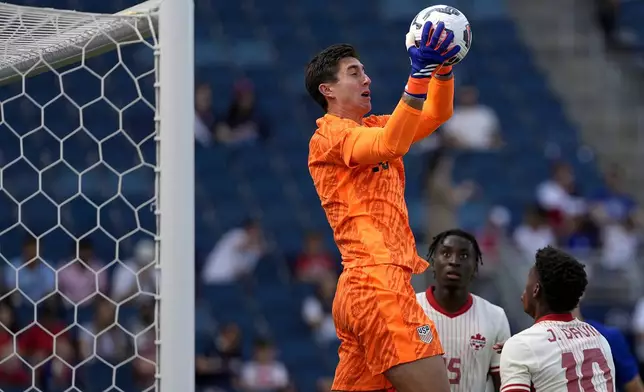 United States goalkeeper Patrick Schulte catches a high cross during the first half of an international friendly soccer game against Canada, Saturday, Sept. 7, 2024, in Kansas City, Mo. (AP Photo/Charlie Riedel)