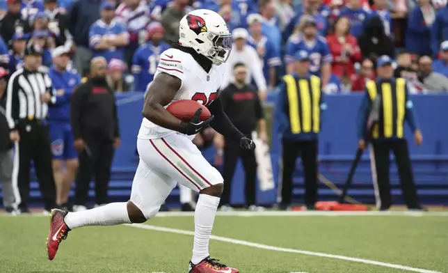 Arizona Cardinals kick returner DeeJay Dallas returns a kickoff for a touchdown against the Buffalo Bills during the second half of an NFL football game Sunday, Sept. 8, 2024, in Orchard Park, N.Y. (AP Photo/Jeffrey T. Barnes)