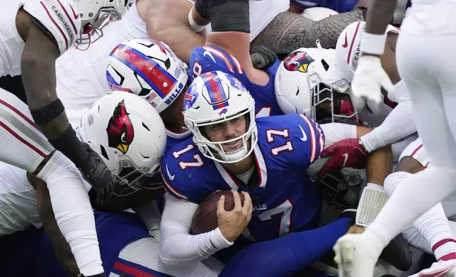 Buffalo Bills quarterback Josh Allen (17) runs for a first down against the Arizona Cardinals during the second half of an NFL football game Sunday, Sept. 8, 2024, in Orchard Park, N.Y. (AP Photo/Matt Slocum)