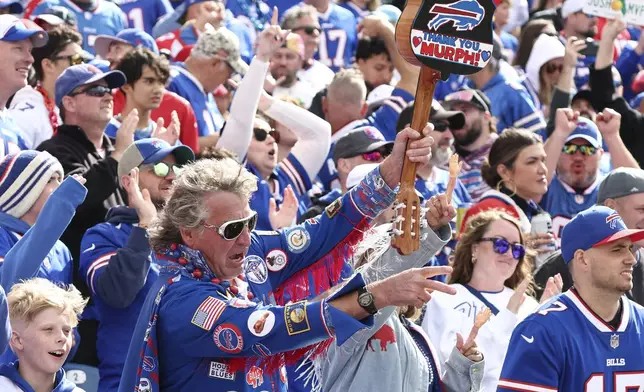 Buffalo Bills fans celebrate a Bills touchdown against the Arizona Cardinals during the second half of an NFL football game Sunday, Sept. 8, 2024, in Orchard Park, N.Y. (AP Photo/Jeffrey T. Barnes)