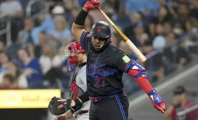 Toronto Blue Jays' Vladimir Guerrero Jr. (27) reacts after striking out against the St. Louis Cardinals in the first inning during baseball game action in Toronto, Friday Sept. 13, 2024. (Chris Young/The Canadian Press via AP)