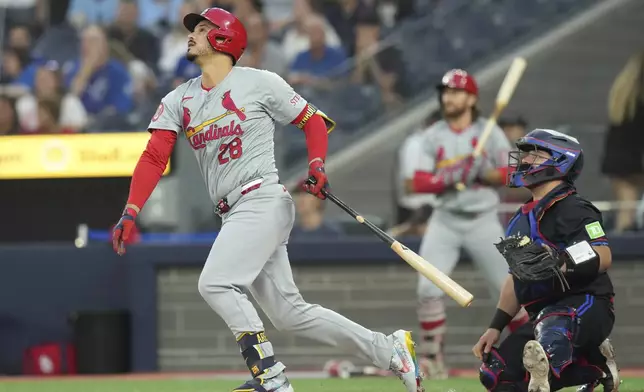 St. Louis Cardinals' third baseman Nolan Arenado (28) hits an RBI single against the Toronto Blue Jays in the first inning during MLB baseball action in Toronto, Friday, Sept. 13, 2024. (Chris Young/The Canadian Press via AP)