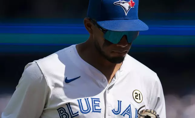 Toronto Blue Jays Leo Jiménez walks to the dugout between innings against the St. Louis Cardinals during baseball game action in Toronto, Sunday, Sept. 15, 2024. (Paige Taylor White/The Canadian Press via AP)