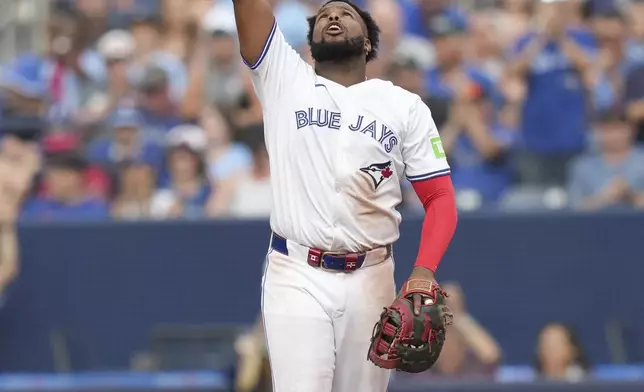 Toronto Blue Jays first baseman Vladimir Guerrero Jr. reacts after defeating the St. Louis Cardinals in interleague MLB baseball action in Toronto, Saturday, September 14, 2024. (Chris Young/The Canadian Press via AP)