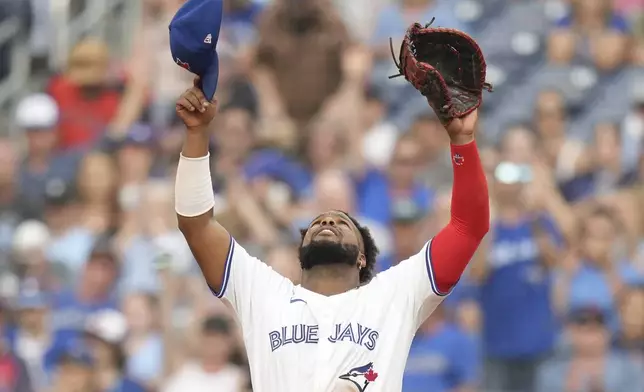 Toronto Blue Jays first baseman Vladimir Guerrero Jr. reacts after defeating the St. Louis Cardinals in interleague MLB baseball action in Toronto, Saturday, September 14, 2024. (Chris Young/The Canadian Press via AP)