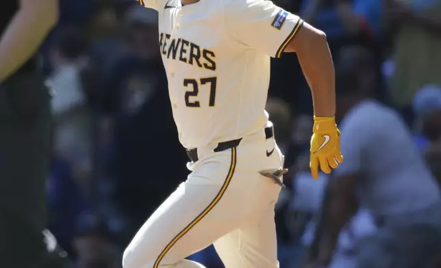 Milwaukee Brewers Willy Adames (27) reacts rounding the bases after his three-run home run during the first inning of a baseball game against the St. Louis Cardinals Monday, Sept. 2, 2024, in Milwaukee. (AP Photo/Jeffrey Phelps)