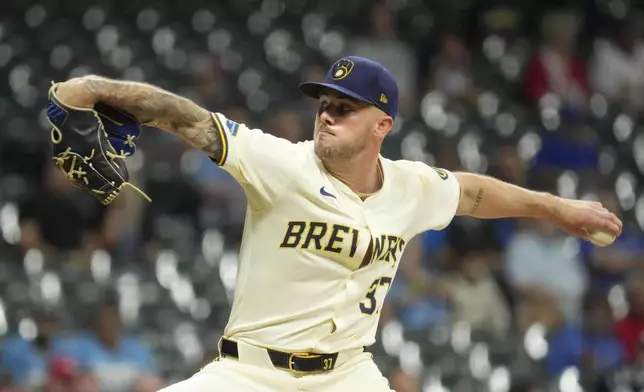 Milwaukee Brewers pitcher DL Hall throws during the fifth inning of a baseball game against the St. Louis Cardinals, Wednesday, Sept. 4, 2024, in Milwaukee. (AP Photo/Kayla Wolf)