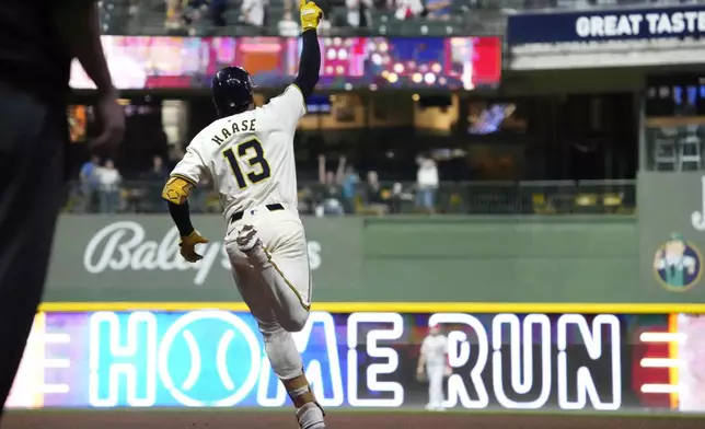 Milwaukee Brewers' Eric Haase celebrates after hitting a home run in the eighth inning of a baseball game against the St. Louis Cardinals, Wednesday, Sept. 4, 2024, in Milwaukee. (AP Photo/Kayla Wolf)