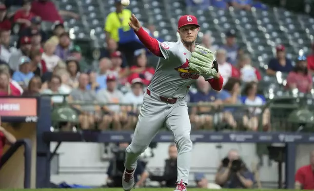 St. Louis Cardinals pitcher Sonny Gray throws to first for the out on a bunt by Milwaukee Brewers' Garrett Mitchell during the second inning of a baseball game Wednesday, Sept. 4, 2024, in Milwaukee. (AP Photo/Kayla Wolf)