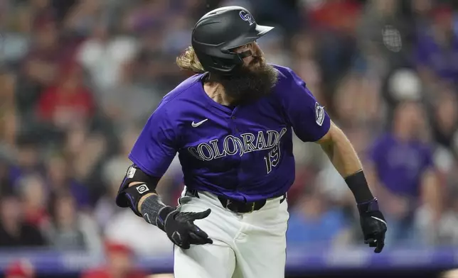 Colorado Rockies' Charlie Blackmon heads up the first-base line after connecting for an RBI triple off St. Louis Cardinals starting pitcher Michael McGreevy in the fifth inning of a baseball game Tuesday, Sept. 24, 2024, in Denver. (AP Photo/David Zalubowski)