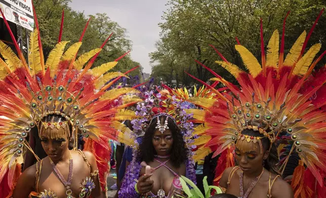 FILE - Dancers participate in the West Indian Day Parade, Monday, Sept. 4, 2023, in the Brooklyn borough of New York. (AP Photo/Yuki Iwamura, File)