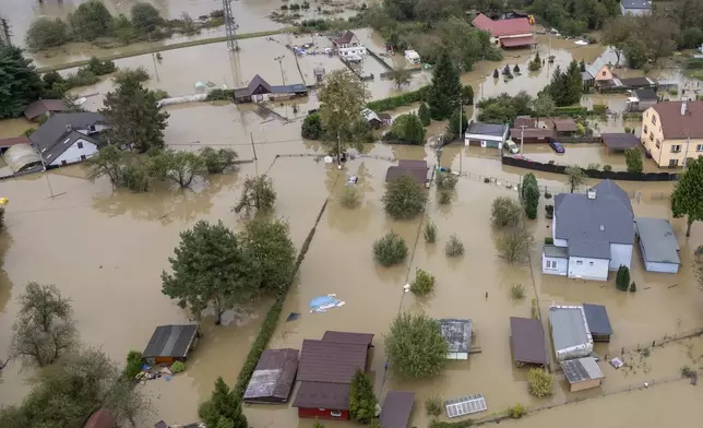 An aerial view of a flooded neighborhood in Ostrava, Czech Republic, Monday, Sept. 16, 2024. (AP Photo/Darko Bandic)