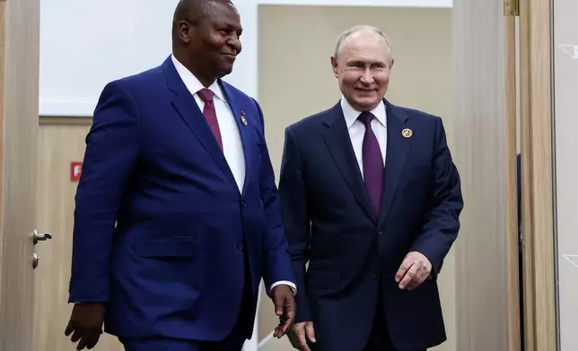 FILE - Russian President Vladimir Putin, right, and Central African Republic President Faustin-Archange Тouadera walk during their meeting on the sideline of the Russia Africa Summit in St. Petersburg, Russia, Friday, July 28, 2023. (Artyom Geodakyan/TASS Host Photo Agency Pool Photo via AP, File)