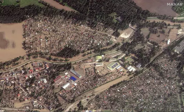 This satellite image released by Maxar Technologies shows flooded homes and businesses following heavy rains in Kravare, Czech Republic, Tuesday, Sept. 17, 2024. (Satellite image ©2024 Maxar Technologies via AP)