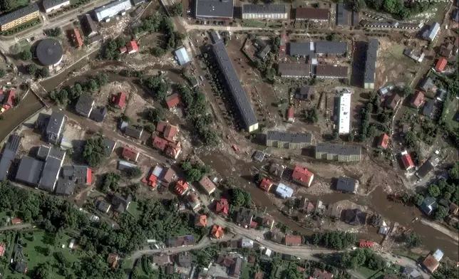 This satellite image released by Maxar Technologies shows debris and mud after heavy rains and flooding in Stronie Slaskie, Poland, Tuesday, Sept. 17, 2024. (Satellite image ©2024 Maxar Technologies via AP)