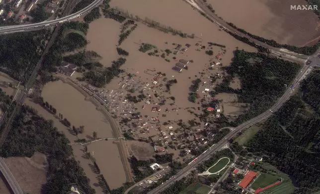 This satellite image released by Maxar Technologies shows flooded homes and fields following record rains in Ostrava, Czech Republic, Tuesday, Sept. 17, 2024. (Satellite image ©2024 Maxar Technologies via AP)