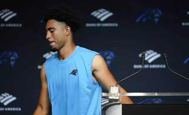 Carolina Panthers quarterback Bryce Young leaves a news conference after their loss to the Los Angeles Chargers in an NFL football game on Sunday, Sept. 15, 2024, in Charlotte, N.C. (AP Photo/Erik Verduzco)