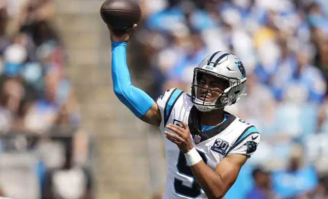 Carolina Panthers quarterback Bryce Young passes against the Los Angeles Chargers during the first half of an NFL football game on Sunday, Sept. 15, 2024, in Charlotte, N.C. (AP Photo/Erik Verduzco)