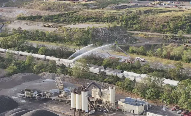 Firefighters work on the scene of a chemical leak in railcars near Cleves, Ohio, Tuesday, Sept. 24, 2024. (Local 12/WKRC via AP)