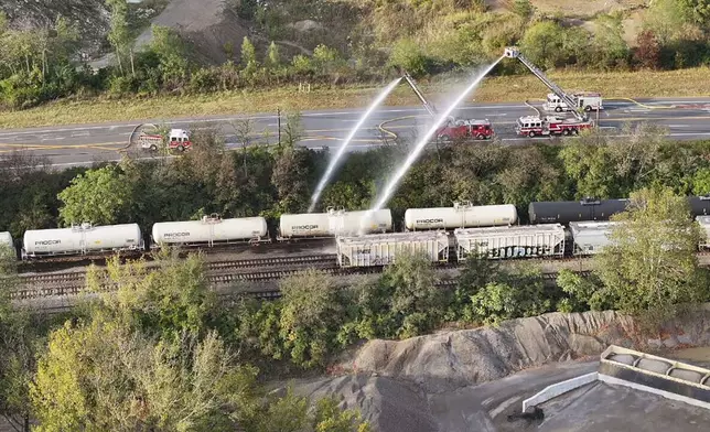 Firefighters work on the scene of a chemical leak in railcars near Cleves, Ohio, Tuesday, Sept. 24, 2024. (Local 12/WKRC via AP)