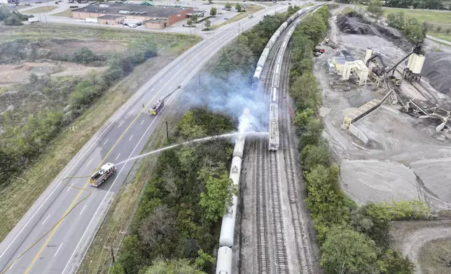 Firefighters work on the scene of a chemical leak in railcars near Cleves, Ohio, Tuesday, Sept. 24, 2024. (Local 12/WKRC via AP)