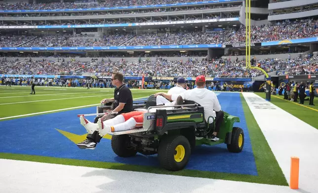 Kansas City Chiefs wide receiver Rashee Rice is taken off the field on a cart after being injured during the first half of an NFL football game against the Los Angeles Chargers Sunday, Sept. 29, 2024, in Inglewood, Calif. (AP Photo/Ashley Landis)